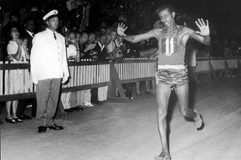 Abebe Bikila running the Olympic Marathon barefoot.